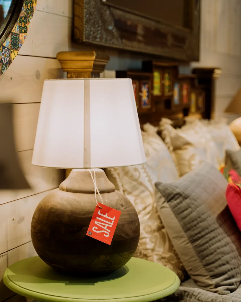 Sculptural table lamp with a ceramic base in a layered home setting