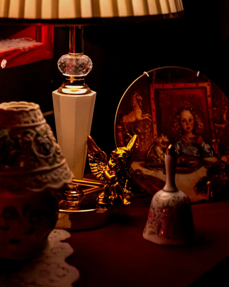 Warm red interior still life with layered decorative objects